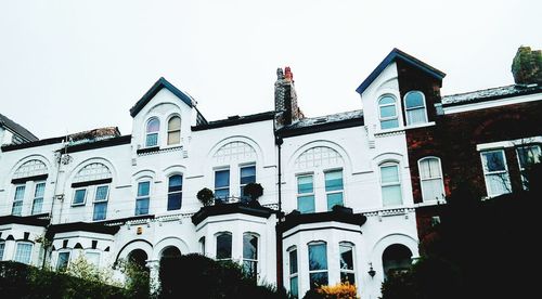 Low angle view of buildings against clear sky