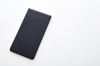 High angle view of book against white background