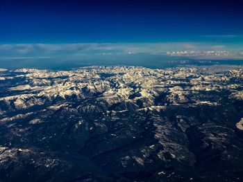 Aerial view of landscape against sky during winter