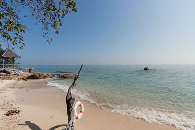 Scenic view of beach against clear sky