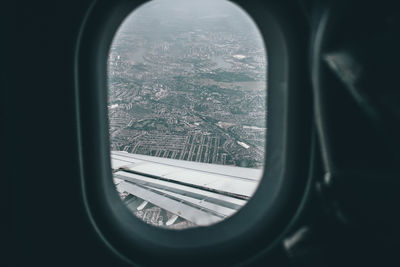 City seen through aircraft window