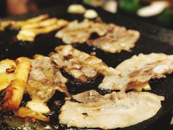 Close-up of meat in cooking pan