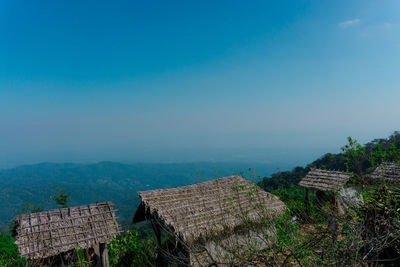 High angle view of buildings against blue sky