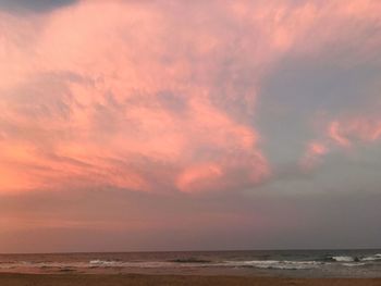 Scenic view of beach against sky during sunset