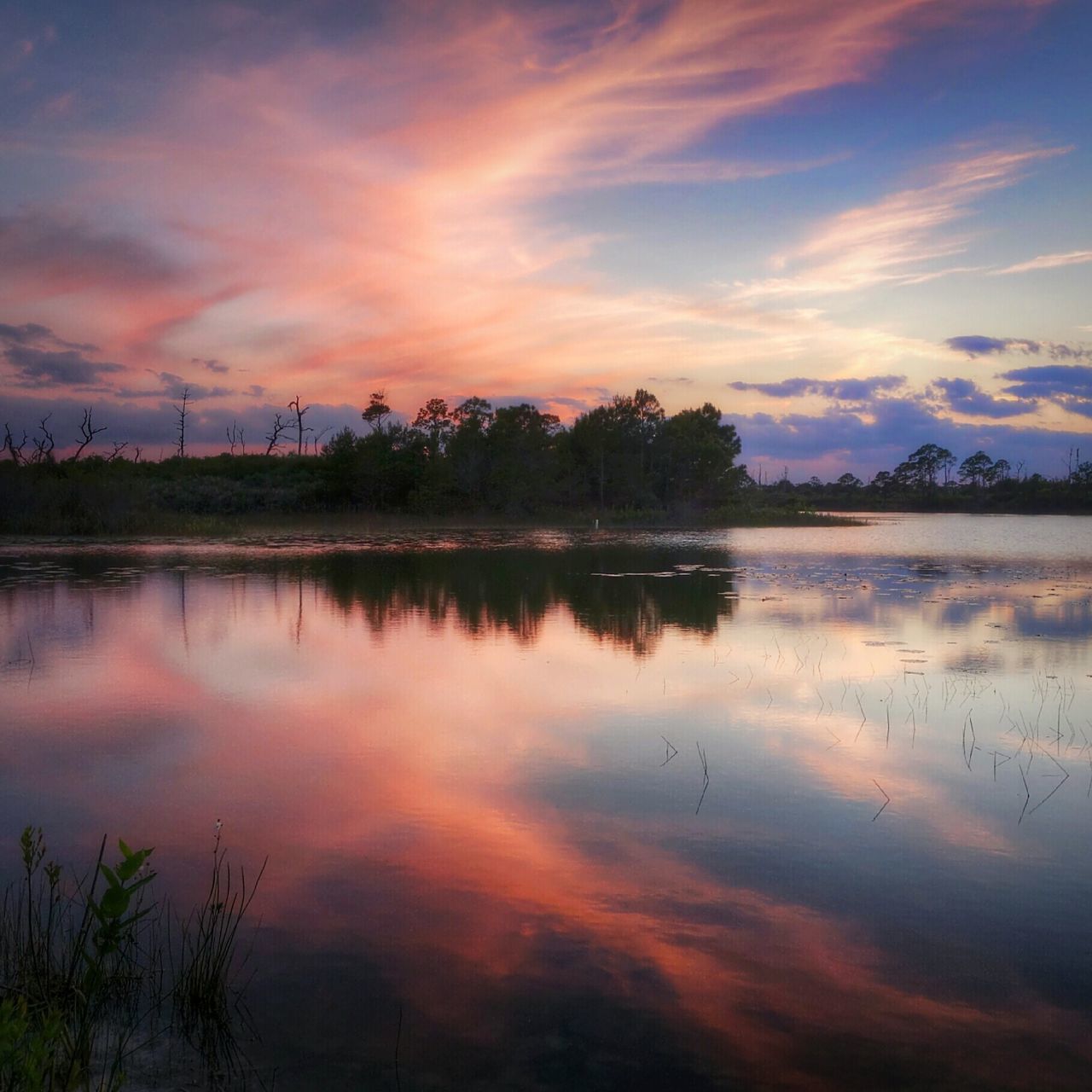 reflection, water, sunset, lake, tranquil scene, tranquility, sky, scenics, beauty in nature, cloud - sky, idyllic, silhouette, nature, standing water, tree, cloud, waterfront, orange color, calm, symmetry