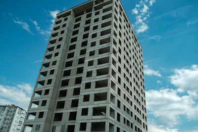 Low angle view of skyscraper against sky