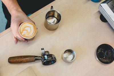 High angle view of coffee cup on table