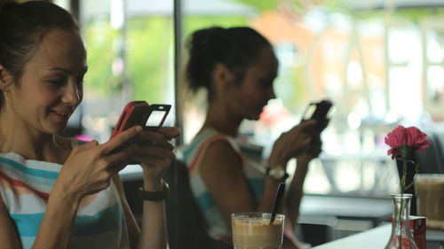 Young woman using mobile phone