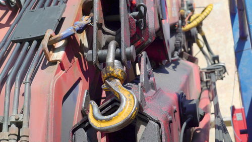 Close-up of padlocks hanging on metal chain