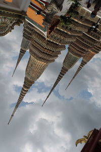 Low angle view of statue against cloudy sky