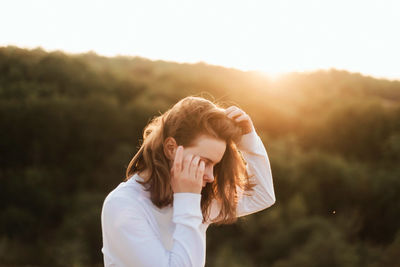 Portrait of a young woman on a sunny day in autumn