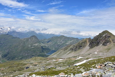 Scenic view of mountains against cloudy sky