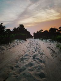 Scenic view of beach against sky during sunset