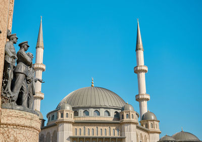 Low angle view of building against blue sky