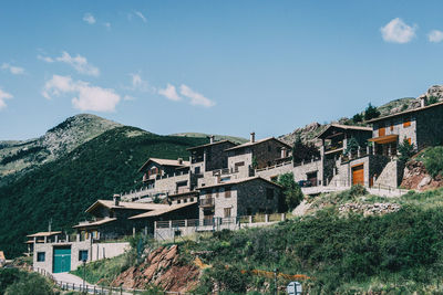 Buildings in town against sky