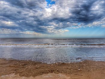 Scenic view of beach against sky