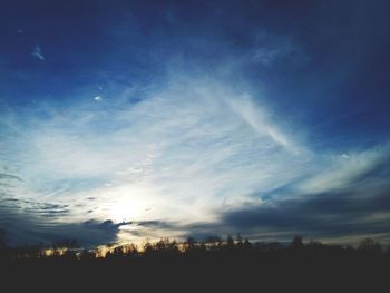 Silhouette of trees against sky at sunset