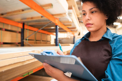 Young woman reading book