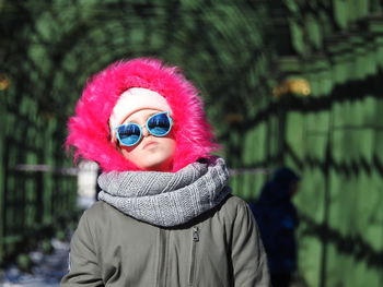 Teenage girl wearing fur coat