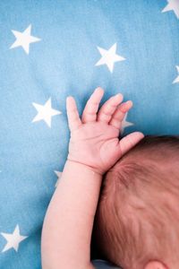 Cropped hand of woman holding flag