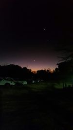 Scenic view of landscape against sky at night