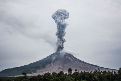 Scenic view of volcanic mountain against sky