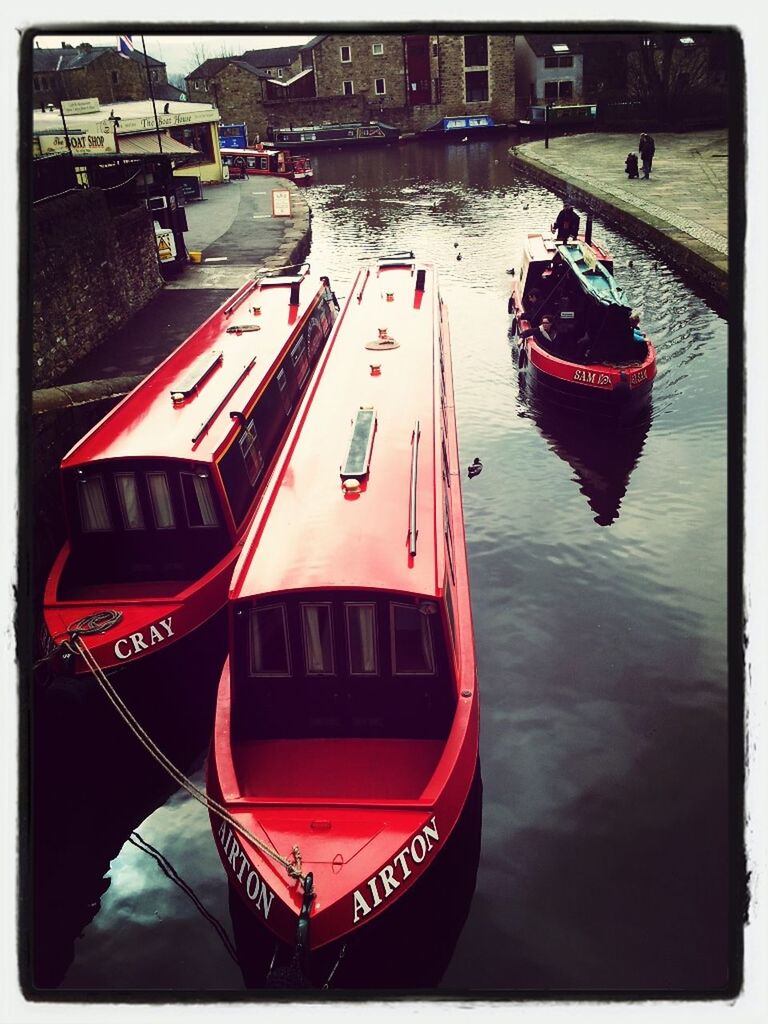 transportation, mode of transport, transfer print, nautical vessel, water, boat, auto post production filter, moored, red, travel, high angle view, land vehicle, river, building exterior, city, car, waterfront, architecture, built structure, outdoors