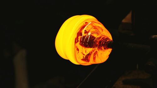 Close-up of yellow light bulb