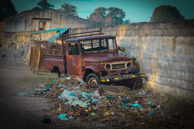 Old abandoned car on the road