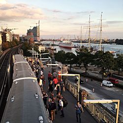 Panoramic view of people in city against sky