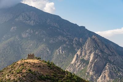 Low angle view of mountain range against sky