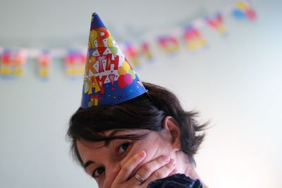 Close-up portrait of woman wearing hat in party