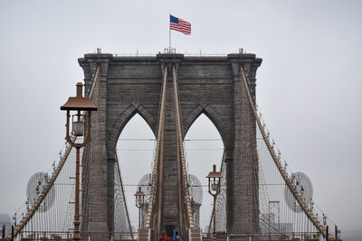 Brooklyn bridge in lower manhattan is seen on a foggy day, march 17, 2022 in new york city.