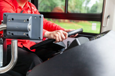 Man using mobile phone in bus