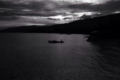 Scenic view of sea against cloudy sky