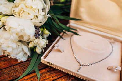 Close-up of diamond necklace on table