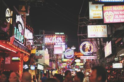 People on street market in city at night