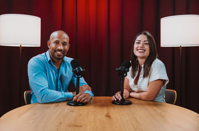 Portrait of young woman sitting at home