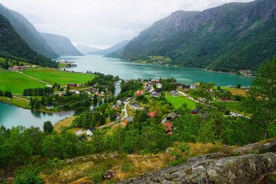 Scenic view of lake and mountains against sky