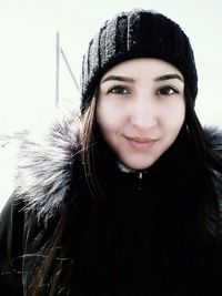 Portrait of smiling young woman in winter