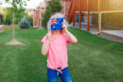 Boy standing on field