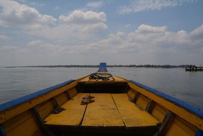 Boat sailing in sea against sky