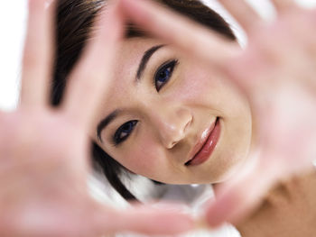Close-up portrait of woman gesturing