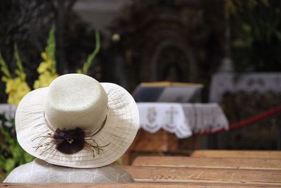 Close-up of hat against altar 