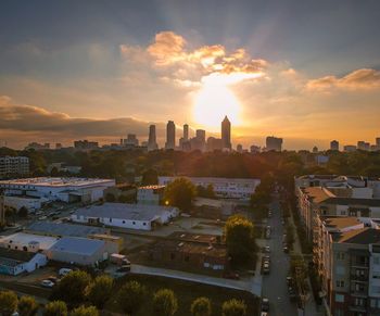 High angle view of buildings against sky during sunset