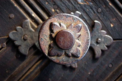 Detail of old wooden door with rusty door knob
