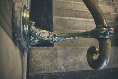 Close-up of faucet on water