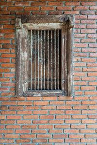 Window on brick wall of old building