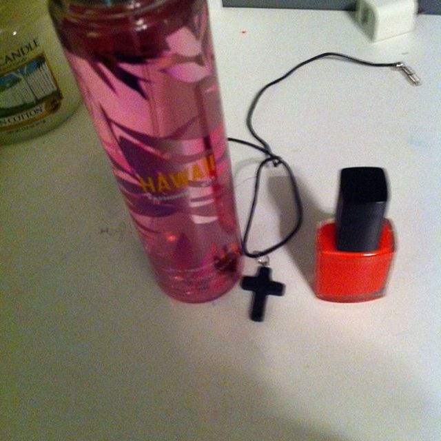 indoors, table, still life, close-up, red, drink, high angle view, bottle, refreshment, glass - material, no people, drinking glass, focus on foreground, technology, wall - building feature, selective focus, shadow, pink color, plastic, reflection