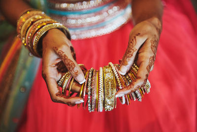 Low angle view of woman with arms raised